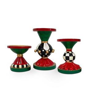 https://www.janeleslieco.com/products/mackenzie-childs-jolly-holiday-pillar-candle-holders-set-of-3